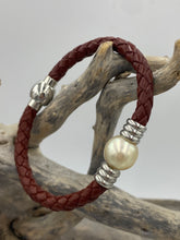 Load image into Gallery viewer, &#39;Pam&#39; is a braided leather bracelet featuring a white Circle Button 12.1mm South Sea Broome pearl

This bracelet is made out of braided dark brown leather and a stainless steel magnetic clasp
