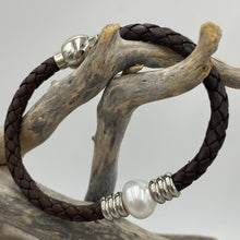 Load image into Gallery viewer, &#39;Pam&#39; is a braided leather bracelet featuring a white Circle Button 12.1mm South Sea Broome pearl

This bracelet is made out of braided dark brown leather and a stainless steel magnetic clasp
