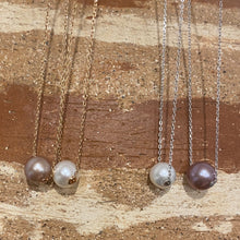 Load image into Gallery viewer, This Slider necklace features a single 10-11mm Round freshwater pearl   Choose a Pink, White or Grey pearl  Then choose if you want a rose gold or silver chain  The chain is Sterling Silver Trace Chain with a protective cheneer tube through the pearl for protection and easy sliding  The chains are adjustable in length from 40cm or 45cm
