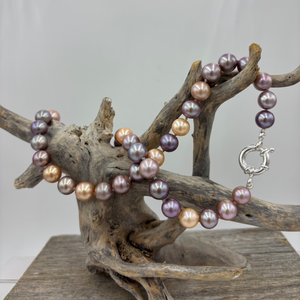 Stunning top quality natural colour Kasumi pearl strand&nbsp; featuring shades of natural pink, lavender and apricot. The lustre on these pearl is excellent.

This strand is 47cm long and the pearls are Round and 9 to 10.5mm in size.

They feature a 925 sterling silver 'Italian'&nbsp; Bolt Ring clasp that can be worn at the front and a pendant attached to it as a feature.