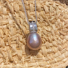 Load image into Gallery viewer, Sterling silver and rhodium coated  pendant featuring Baroque Drop shaped natural lavender color freshwater pearl, Lavender with pink hues, 11.5 x 14.5mm in size, nice lustre  This pendant features a row of Cubic Zirconia 
