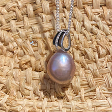 Load image into Gallery viewer, Sterling silver and rhodium coated  pendant featuring Baroque Drop shaped natural lavender color freshwater pearl, Lavender with pink hues, 11.5 x 14.5mm in size, nice lustre  This pendant features a row of Cubic Zirconia 
