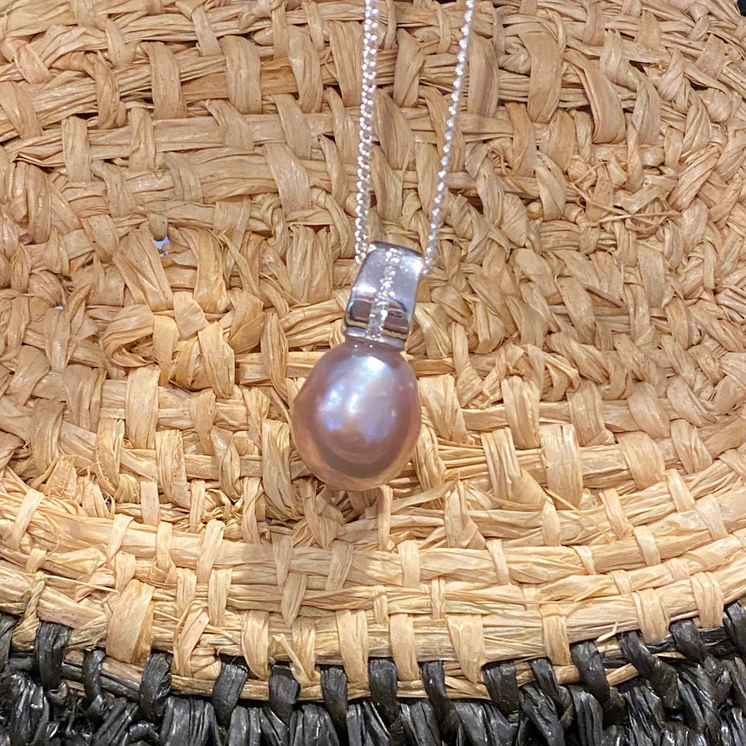 Sterling silver and rhodium coated  pendant featuring Baroque Drop shaped natural lavender color freshwater pearl, Lavender with pink hues, 11.5 x 14.5mm in size, nice lustre  This pendant features a row of Cubic Zirconia 