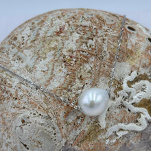 Load image into Gallery viewer, This versatile Slider necklace features a single Drop shape White&nbsp; freshwater pearl, 11 x 13mm in size

The chain is Sterling Silver and is adjustable up to 45cm using an easy pull tag .

It has protective silver hole covers to finish this off nicely and for protection and easy sliding
