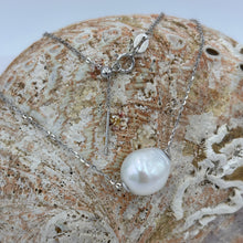 Load image into Gallery viewer, This versatile Slider necklace features a single Drop shape White&nbsp; freshwater pearl, 11 x 13mm in size

The chain is Sterling Silver and is adjustable up to 45cm using an easy pull tag .

It has protective silver hole covers to finish this off nicely and for protection and easy sliding
