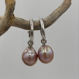The 'Hoop'&nbsp; Sterling Silver Earrings feature lustrous natural Pink Freshwater Pearls that can be interchanged.

The pearls are Drop Semi baroque in shape and 11 x 13mm in size and deep pink in colour.

Stud fitting with overall measurement: 35mm
Pearl size: 11mm