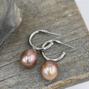 The 'Hoop'&nbsp; Sterling Silver Earrings feature lustrous natural Pink Freshwater Pearls that can be interchanged.

The pearls are Drop Semi baroque in shape and 11 x 13mm in size and deep pink in colour.

Stud fitting with overall measurement: 35mm
Pearl size: 11mm