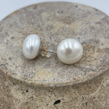 Load image into Gallery viewer, hese large white Freshwater pearl studs are 12.8 mm in size, Button in shape and are&nbsp; white colour and high lustrre.&#39;

They are set on 9ct White gold settings.
