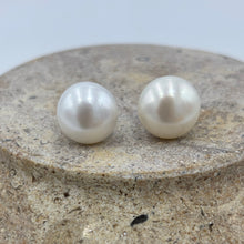 Load image into Gallery viewer, hese large white Freshwater pearl studs are 12.8 mm in size, Button in shape and are&nbsp; white colour and high lustrre.&#39;

They are set on 9ct White gold settings.
