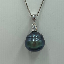 Load image into Gallery viewer, Sterling silver pendant featuring a single claw set cubic zirconia and a Tahitian South Sea Pearl, Circle Button in shape, 13mm in size and natural Peacock Green with Blue  tones  J3251
