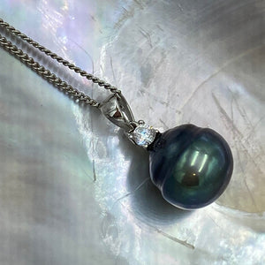 Sterling silver pendant featuring a single claw set cubic zirconia and a Tahitian South Sea Pearl, Circle Button in shape, 13mm in size and natural Peacock Green with Blue  tones  J3251