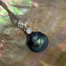 Load image into Gallery viewer, Sterling silver pendant featuring a single claw set cubic zirconia and a Tahitian South Sea Pearl, Circle Button in shape, 13mm in size and natural Peacock Green with Blue  tones  J3251
