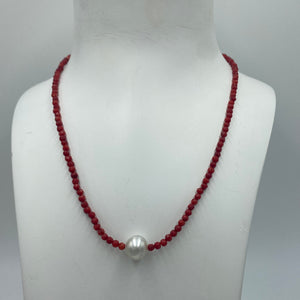 Australian South Sea pearl necklace with faceted red agate gemstones and a sterling silver peanut clasp  This stunning necklace features a single White Australian  South Sea pearls ,  Button in shape,  10.2mm in size, and White with Silver hues in color  The overall length is 42cm  Good lustre and light natural 'birthmarks'  J3335