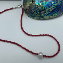 Load image into Gallery viewer, Australian South Sea pearl necklace with faceted red agate gemstones and a sterling silver peanut clasp  This stunning necklace features a single White Australian  South Sea pearls ,  Button in shape,  10.2mm in size, and White with Silver hues in color  The overall length is 42cm  Good lustre and light natural &#39;birthmarks&#39;  J3335
