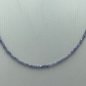 This stunning necklace features 2mm facetted blue Tanzanite gemstones, with a 925 sterling silver peanut clasp. It can be used as a necklace on it own or as a chain to hold a pendant.  It is on 49 strand high strength US wire with scrimps for security  Finished length is 45cm