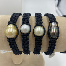 Load image into Gallery viewer, Macrame bracelet (thick thread black) featuring an Australian (Broome) South Sea Pearl, Drop in shape, 12.7 x 14mm in size, silver in colour with white hues.  (J2708)  This bracelet is made from water and colorfast nylon material for heavy duty wear and tear, features no glue and no metal parts   Pictured far right in group photo

