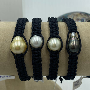 Thick Black Macrame bracelet featuring an Indonesian South Sea Pearl, Circle Drop in shape, 13.2 x 14.8mm in size, Gold in colour, high lustre and clean skin.  (J3317)  This bracelet is made from water and colorfast nylon material for heavy duty wear and tear, features no glue and no metal parts