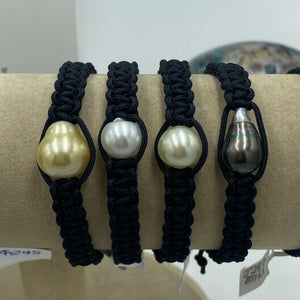 Macrame bracelet (thick thread black) featuring an Australian South Sea Pearl, Button in shape, 11.3mm in size, Champagne in colour.  (J3320)  This bracelet is made from water and colorfast nylon material for heavy duty wear and tear, features no glue and no metal parts   Pictured second from right in group photo