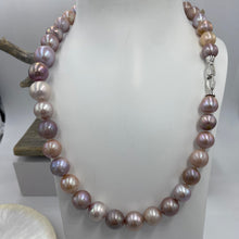 Load image into Gallery viewer, Large Freshwater pearl strand featuring shades of natural pink, lavender and white with average lustre.

This strand is 52cm long and the pearls are mixed shapes Off Round and Oval, 11-14.5mm in size with a non tarnish sterling silver clasp

SH513
