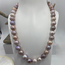 Load image into Gallery viewer, Large Freshwater pearl strand featuring shades of natural pink, lavender and white with average lustre.

This strand is 52cm long and the pearls are mixed shapes Off Round and Oval, 11-14.5mm in size with a non tarnish sterling silver clasp

SH513
