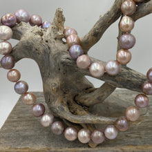 Load image into Gallery viewer, Large Freshwater pearl strand featuring shades of natural pink, lavender and white with average lustre.

This strand is 52cm long and the pearls are mixed shapes Off Round and Oval, 11-14.5mm in size with a non tarnish sterling silver clasp

SH513
