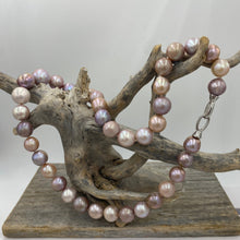 Load image into Gallery viewer, Large Freshwater pearl strand featuring shades of natural pink, lavender and white with average lustre.

This strand is 52cm long and the pearls are mixed shapes Off Round and Oval, 11-14.5mm in size with a non tarnish sterling silver clasp

SH513
