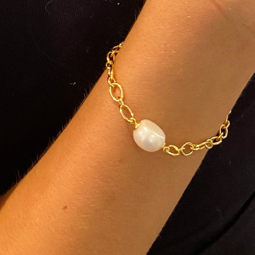 Gold chain bracelet featuring an 11.5mm White Button shape freshwater pearl  This bracelet is 18ct gold over 925 Sterling silver and features a lobster clasp  The length is adjustable by using the shorter links to attach the lobster clasp   There is a similar matching necklace with the same name for $195