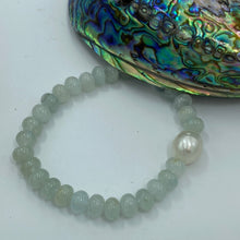 Load image into Gallery viewer, &lt;p&gt;Amazing Aquamarine bracelet featuring a white Australian South Sea Pearl&lt;/p&gt; &lt;p&gt;Pearl is a drop shape, and is 11.6 x 14mm in size and is white in colour&lt;/p&gt; &lt;p&gt;The Aquamarine beads are polished button shaped and are 8 x 6mm in size&lt;/p&gt; &lt;p&gt;This bracelet is easy to slip on and off as it&#39;s made on elastic&lt;/p&gt; &lt;p&gt;J3361&lt;/p&gt;
