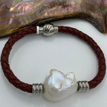 Load image into Gallery viewer, &lt;p&gt;&#39;Pam B&#39; is a braided leather bracelet featuring a white Baroque Freshwater Pearl&lt;/p&gt; &lt;p&gt;The pearl is baroque shape, 20 x 25mm in size and is white with pink hues in colour&lt;/p&gt; &lt;p&gt;This bracelet is made out of braided brown leather and a stainless steel magnetic clasp&lt;/p&gt;
