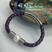 Load image into Gallery viewer, &lt;p&gt;&#39;Pam P&#39; is a braided leather bracelet featuring a white Freshwater Pearl&lt;/p&gt; &lt;p&gt;The pearl is round in shape, 12.8mm in size and is white in colour&lt;/p&gt; &lt;p&gt;This bracelet is made out of braided purple leather and stainless steel with an adjustable metal clasp&lt;/p&gt;
