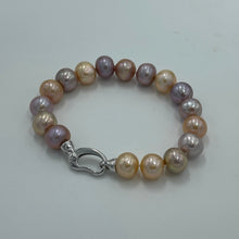 Load image into Gallery viewer, &lt;p&gt;&lt;span style=&quot;font-family: -apple-system, BlinkMacSystemFont, &#39;San Francisco&#39;, &#39;Segoe UI&#39;, Roboto, &#39;Helvetica Neue&#39;, sans-serif; font-size: 0.875rem;&quot;&gt;Freshwater Edison pearl bracelet featuring natural multicolour pearls, natural shades of Pink through to Lavender round shaped pearls, 10 - 11mm in size, with a Sterling Silver clasp.&lt;/span&gt;&lt;/p&gt; &lt;p&gt;20cm in length&lt;/p&gt; &lt;p&gt;Matching strand available featuring an identical clasp - these can be joined together to make a 65cm strand&lt;/p&gt; &lt;p&gt;INS&lt;/p&gt;
