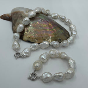 <p>Freshwater pearl strand featuring High lustre Baroque pearls, stunning white in colour</p> <p><span style="font-family: -apple-system, BlinkMacSystemFont, 'San Francisco', 'Segoe UI', Roboto, 'Helvetica Neue', sans-serif; font-size: 0.875rem;">15-30mm in size, 45 in length, with a bolt ring sterling silver clasp</span></p> <p>Matching bracelet available and these can be joined together to make a 66.5cm strand</p> <p>INS</p>