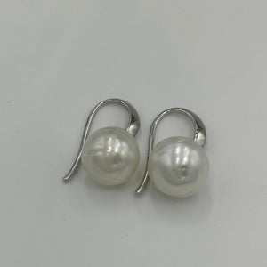 Australian South sea pearl earrings on&nbsp;925 sterling silver 'knife edged' hooks.  They feature circle button pearls, 10.7mm in size and White in color.  J3252