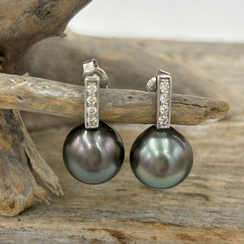 reen in color.  These 925 Sterling silver settings are rhodium coated for a non tarnish finish  They are stud fittings and channel set with Cubic Zirconia.  J3413