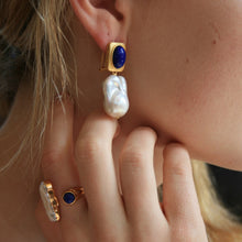 Load image into Gallery viewer, 18K gold plated over 925 sterling silver &quot;continental&quot; clasp style earrings

Satin finish drop earrings featuring Blue Lapis stone at the top with large White Baroquw Freshwater pearls underneath 15 x 21mm&nbsp;

Overall earring length of 40mm

There is a matching ring named &#39;Soul Mate&#39;
