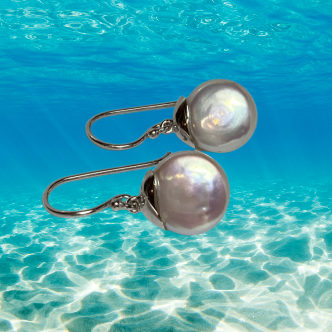 Sterling Silver Shepherds Hook featuring a 10-11mm Coin Freshwater Pearl, White in Colour with Silver-Pink Hues.