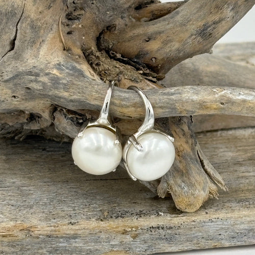 These Classic hook earrings are 18K gold plated over 925 Sterling silver and feature a claw set white Button shape, 11mm freshwater pearl.

Earrings measure 20m from top to bottom.