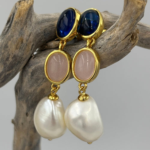 These fabulous stud style earrings are made of 18K gold plated 925 sterling silver. They feature beautiful cabochon bezel set navy and pink gems with a baroque drop white pearl.

The pearls measure 10-11mm.

The size from top to bottom is 40mm.