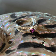 Load image into Gallery viewer, This classic style dress ring is 925 sterling silver and&nbsp; features a 4mm square shaped bezel set synthetic Red Ruby in the centre (6.5 x 8mm including bezel) and 26 pave&nbsp; set cubic zirconia along the band&nbsp;

It is size N1/2
