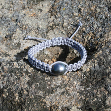 Load image into Gallery viewer, Thick Grey  Macrame Bracelet featuring an Tahitian South Sea Pearl, Drop in shape, 11.8 x 13.1mm in size, Blue Green with Aubergine hues in colour.  This bracelet is made from colour and water fast nylon material for heavy duty wear and tear, features no metal or glue.  (J3318)  Pictured on right in photo of three or third from left in group photo
