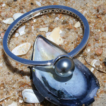 Load image into Gallery viewer, Sterling Silver solid bangle featuring a Tahitian South Sea Pearl  This stunning  pearl  is Tahitian and is Button in shape and 15mm in size.  It is Dark Green with Aubergine hues with High lustre and is featured on this rhodiun coated non tarnish bangle   J3292
