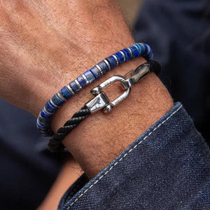 Stunning new range of Unisex Stainless steel and nautical rope jewellery, hand made in Amsterdam and designed with strength to be worn 24/7

Blue Lapis and Grey 4mm semi precious stones with a 4mm Silver slider&nbsp;

Adjustable size

In stock now size M

Also available in other colors and sizes&nbsp;