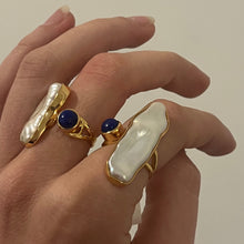 Load image into Gallery viewer, This adjustable ring features Blue Lapis stone with a white baroque Biwa pearl.

They are 18ct yellow gold plated over 925 Sterling Silver

One size fits all

Yisu
