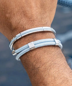 Stunning new range of Men's Stainless steel and nautical rope jewellery, hand made in Amsterdam and designed with strength to be worn 24/7

Silver&nbsp; 6mm cuff with 2mm flat blue rope

In stock now size S/M

Pictured below with 'Little Lewis"

Also available in other colors and sizes&nbsp;