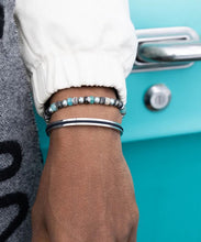 Load image into Gallery viewer, Stunning new range of Men&#39;s Stainless steel and nautical rope jewellery, hand made in Amsterdam and designed with strength to be worn 24/7

Silver&nbsp; 6mm cuff with 2mm flat navy rope

In stock now size M/L

Pictured below with &#39;Bold Bob&#39; and &quot;Brontide&quot;

Also available in other colors and sizes&nbsp;
