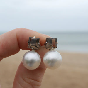 The large Australian South sea pearl earrings have been handcrafted in  925 sterling silver with large Claw set square Smoky Quartz stud fittings   They feature Button shape , 12.1mm Australian pearls that are White with Pink hues.  They are AAA grade with high lustre and clean skin  J3309