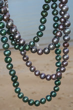Load image into Gallery viewer, Stunning long double strand necklace , 90cm in length and fully knotted.  Freshwater Peacock Green Pearl Strand,  Round in shape, 8.5-10mm in size with a Sterling Silver Clasp  Photo shows both the Peacock Green and Aubergine strands together 
