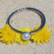 Load image into Gallery viewer, Sterling Silver solid bangle featuring an Australian South Sea Pearl  This stunning  pearl  is an Australian South Sea pearl,  Button in shape and 14.3mm in size. It is White with Silver Pink hues and is featured on this rhodiun coated non tarnish bangle   J3293
