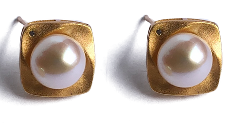 18K gold plated over 925 sterling silver stud style earrings  Satin finish studs with a cubic zirconia and Button shaped Freshwater pearls 7.5-8mm  Overall earring length of 15mm.  Matching pendant available named 'Swirl' pendant 