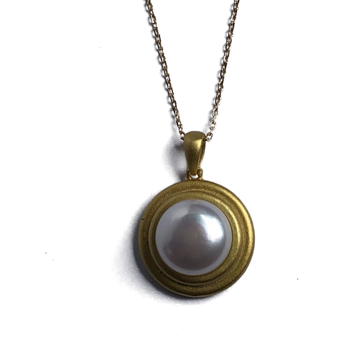 18K gold plated over 925 sterling silver pendant and chain  Satin finish pendant with White Freshwater 12-12.5mm Button shape pearl in the centre  Pendant is 25mm from top to bottom in height  Adjustable chain 40-46cm